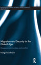 Book cover of: Migration and Security in the Global Age. By: Feargal Cochrane