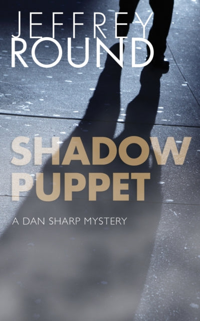 Book cover of: Shadow Puppet. By: Jeffrey Round