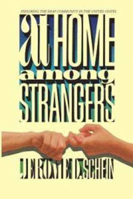 Book cover of: At Home Among Strangers - Exploring the Deaf Community in the United States. By: Jerome D. Schein